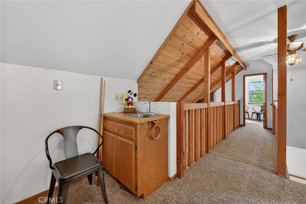 627 Cedar Canyon Road Lake Almanor, CA 96137 - Photo 24 of 34 a view of a hallway with windows
