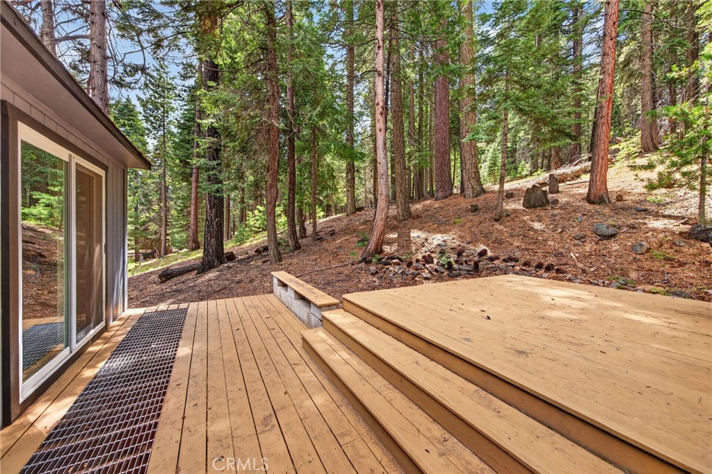 627 Cedar Canyon Road Lake Almanor, CA 96137 - Photo 29 of 34 a view of a backyard with wooden floor and large trees