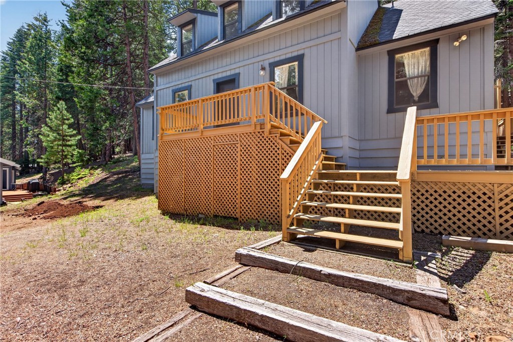 627 Cedar Canyon Road Lake Almanor, CA 96137 - Photo 3 of 34 a front view of a house with a garden