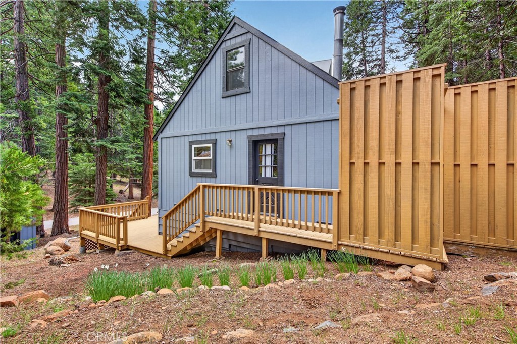 627 Cedar Canyon Road Lake Almanor, CA 96137 - Photo 31 of 34 a view of a house with wooden fence