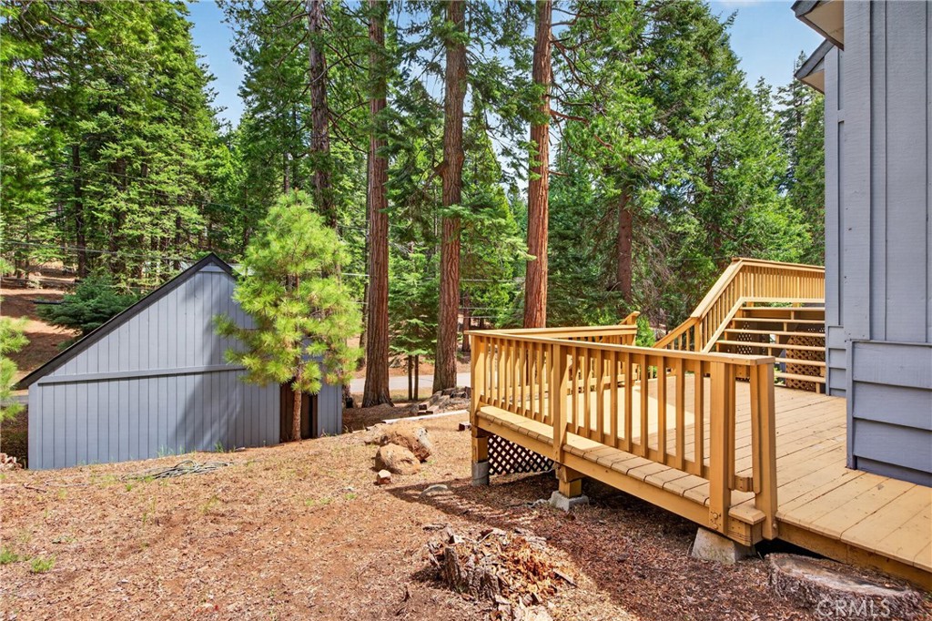 627 Cedar Canyon Road Lake Almanor, CA 96137 - Photo 33 of 34 a view of a roof deck with wooden fence and floor