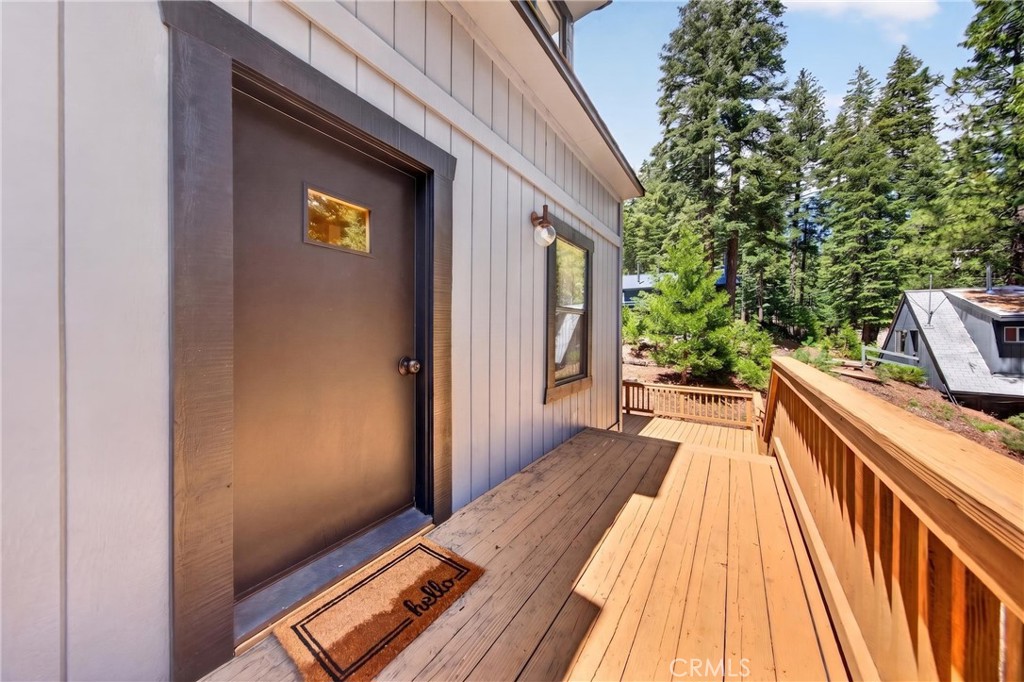 627 Cedar Canyon Road Lake Almanor, CA 96137 - Photo 4 of 34 a view of balcony with wooden floor and outdoor space