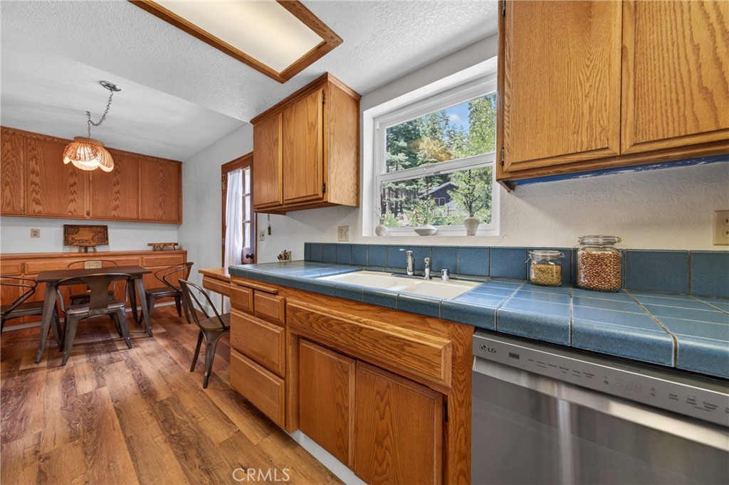 627 Cedar Canyon Road Lake Almanor, CA 96137 - Photo 7 of 34 a kitchen with stainless steel appliances granite countertop a sink stove and cabinets