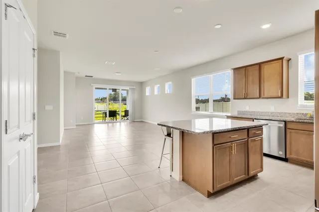 a kitchen with a stove a refrigerator and a sink