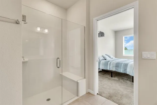 a bathroom with a tub and shower