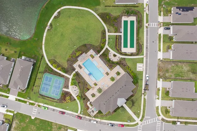 an aerial view of a house with swimming pool