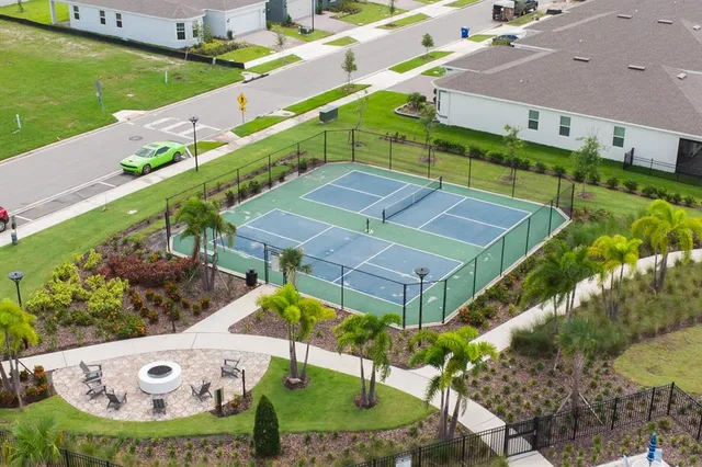 a view of a swimming pool with a yard