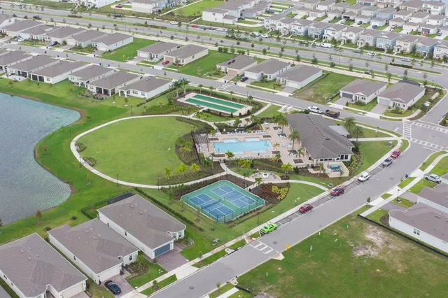 an aerial view of a house with a swimming pool