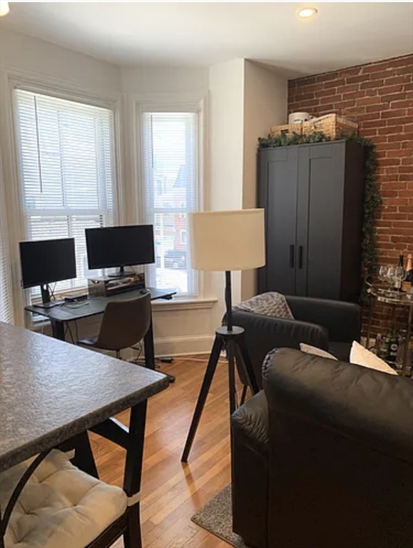 167 I Street, Unit 2 Boston, MA 02127 - Photo 2 of 9 a living room with furniture and a window