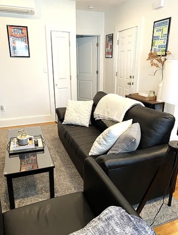 167 I Street, Unit 2 Boston, MA 02127 - Photo 3 of 9 a living room with furniture and wooden floor