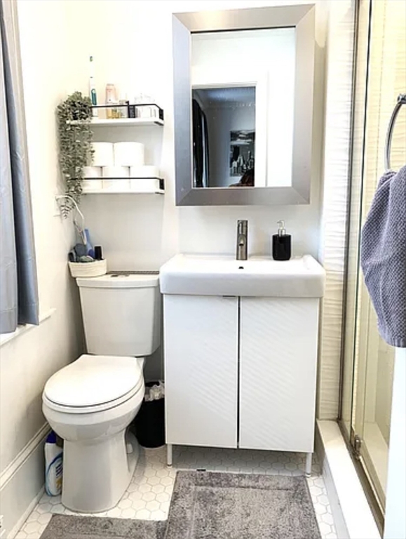 167 I Street, Unit 2 Boston, MA 02127 - Photo 8 of 9 a bathroom with a toilet sink and mirror