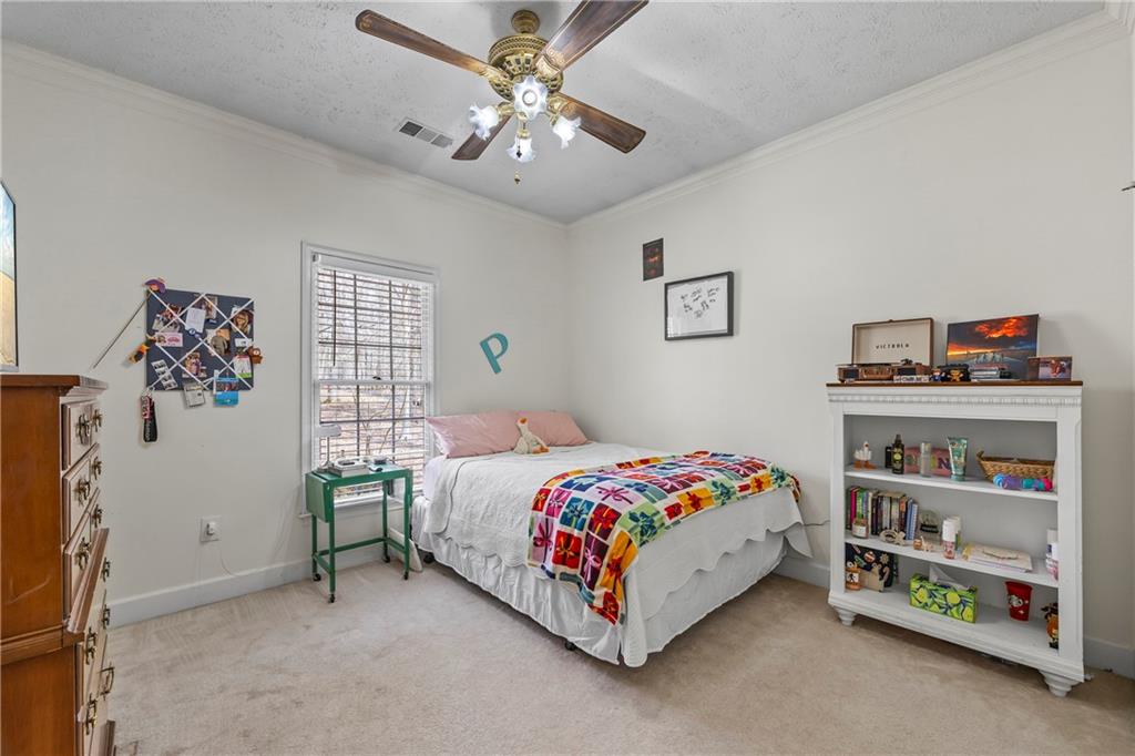 750 Staghorn Trail Nicholson, GA 30565 - Photo 17 of 41 a bedroom with a bed painting on the wall and a window