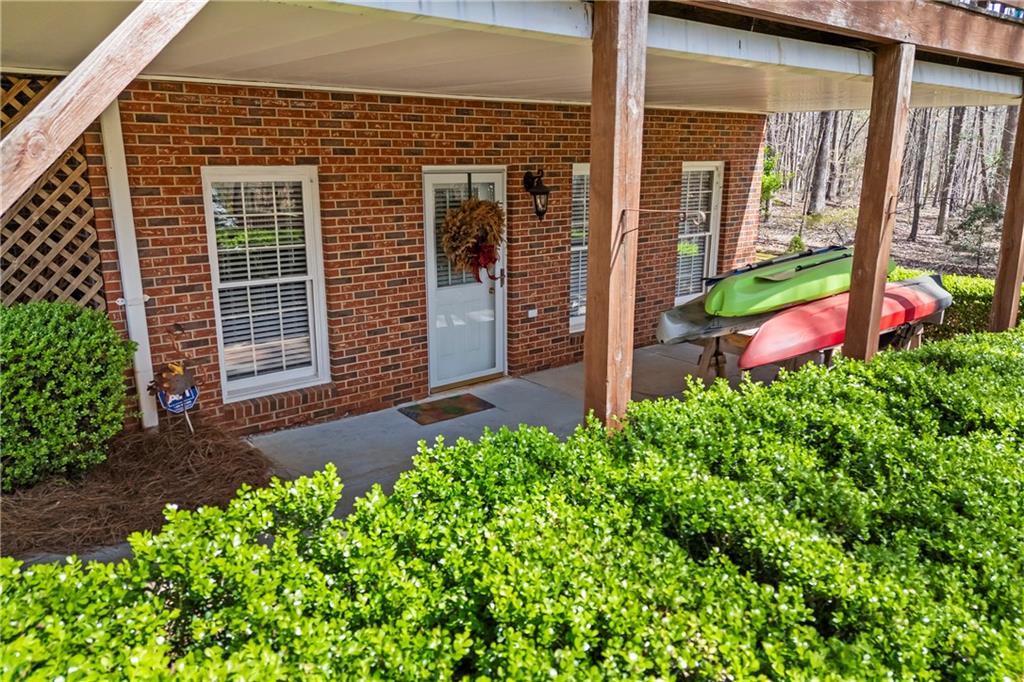 750 Staghorn Trail Nicholson, GA 30565 - Photo 25 of 41 a front view of a house with garden