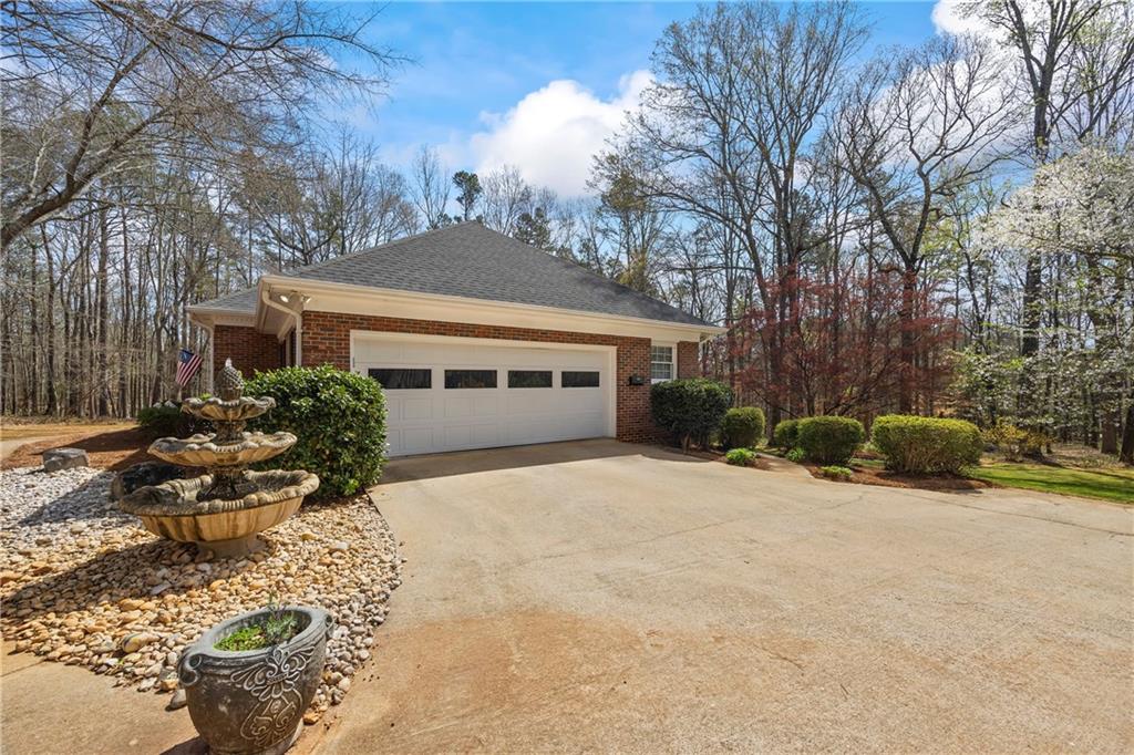 750 Staghorn Trail Nicholson, GA 30565 - Photo 27 of 41 a front view of a house with a yard and garage