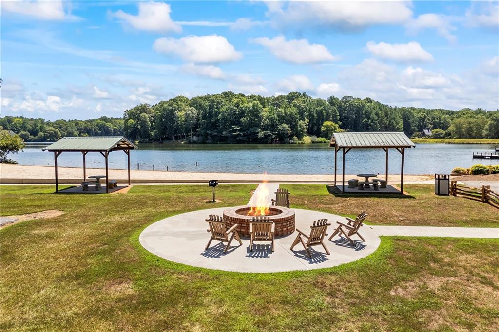 750 Staghorn Trail Nicholson, GA 30565 - Photo 35 of 41 a view of a swimming pool with a table and chairs