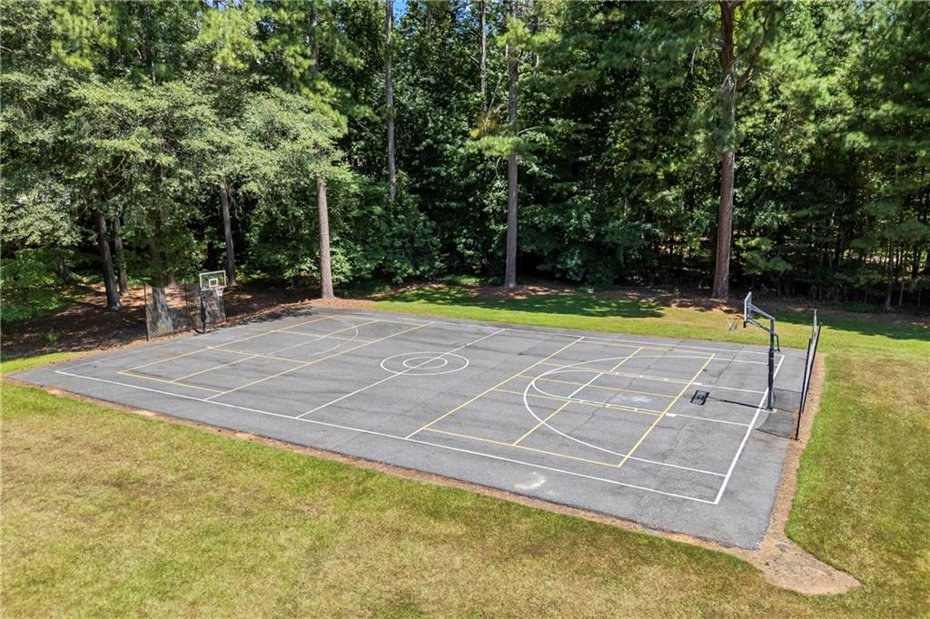 750 Staghorn Trail Nicholson, GA 30565 - Photo 36 of 41 a view of a tennis court with trees in the background