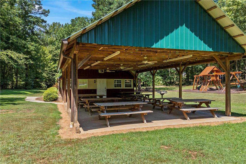 750 Staghorn Trail Nicholson, GA 30565 - Photo 41 of 41 a view of a backyard with table and chairs under an umbrella