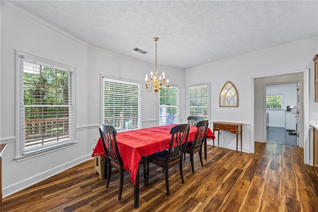 750 Staghorn Trail Nicholson, GA 30565 - Photo 6 of 41 a dining room with furniture window and wooden floor
