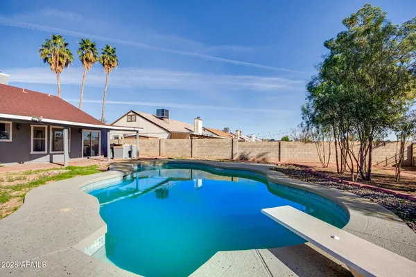 a view of a house with swimming pool