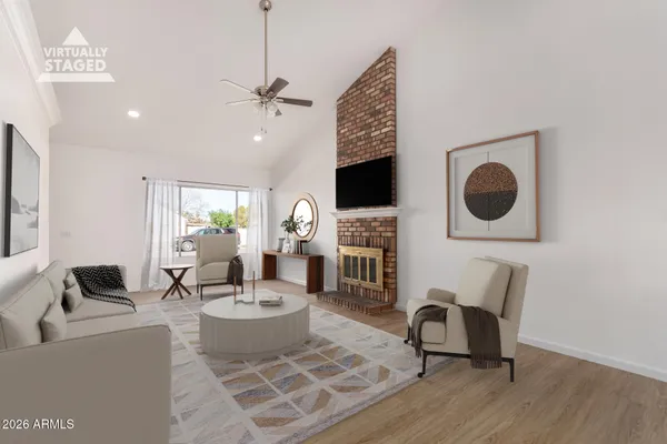 a living room with fireplace furniture and a flat screen tv