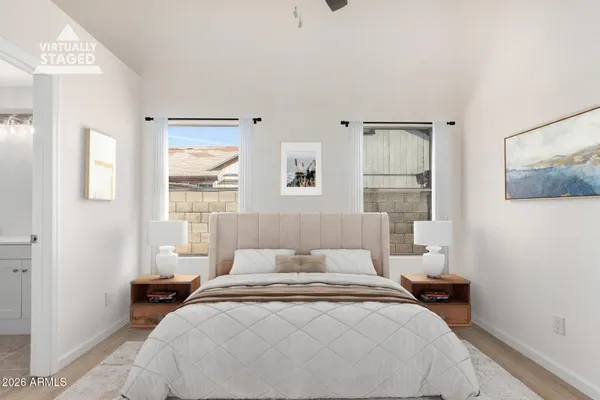 a bedroom with a bed and a window