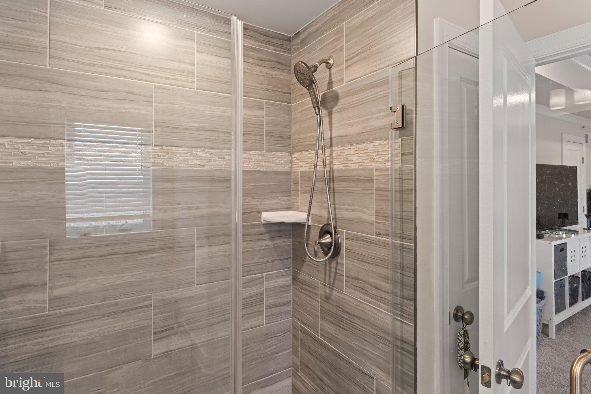 1330 Rail Woodbridge, VA 22191 - Photo 18 of 28 a bathroom with a shower and a mirror