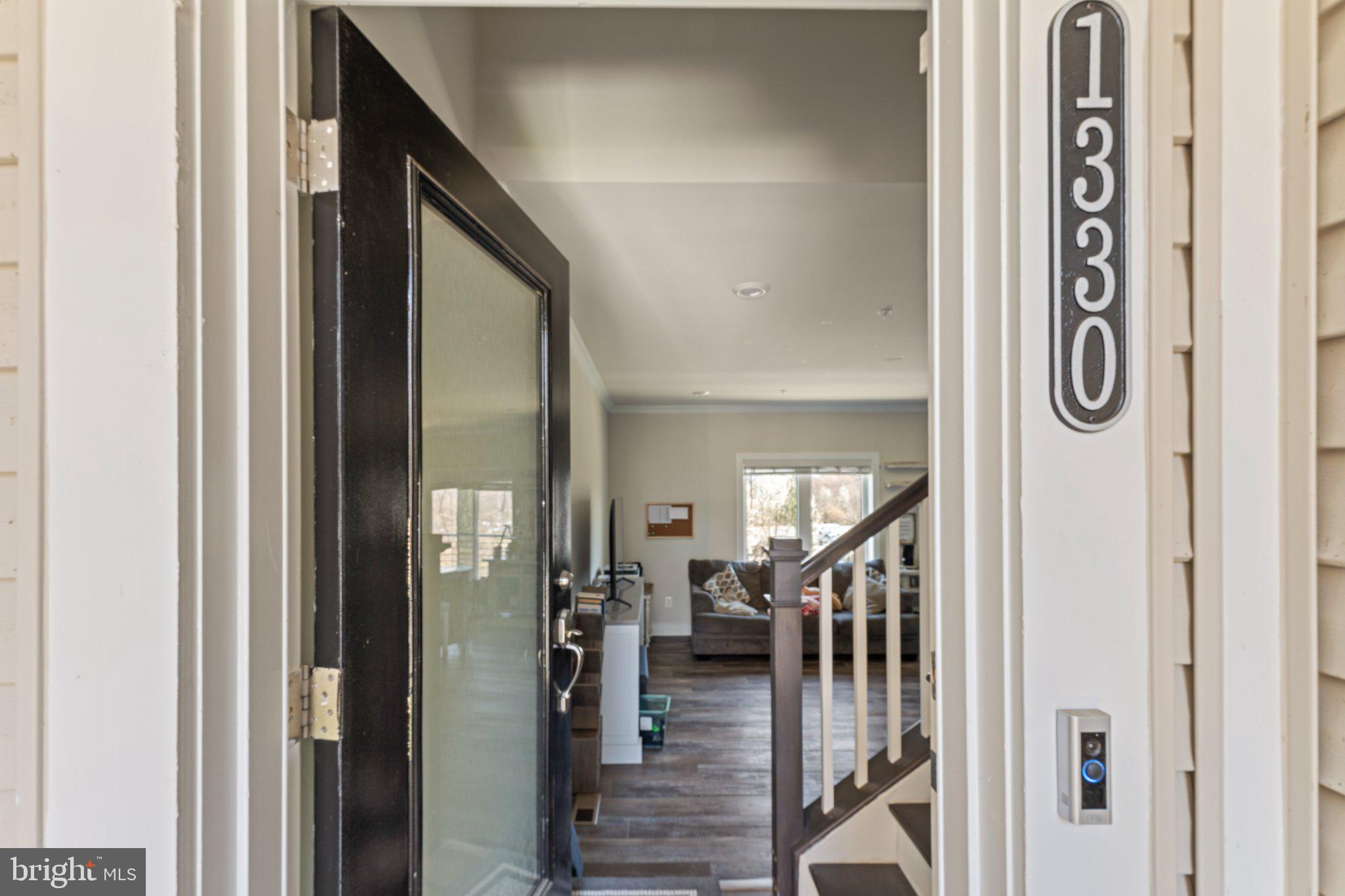 1330 Rail Woodbridge, VA 22191 - Photo 4 of 28 a view of a hallway with wooden floor and staircase