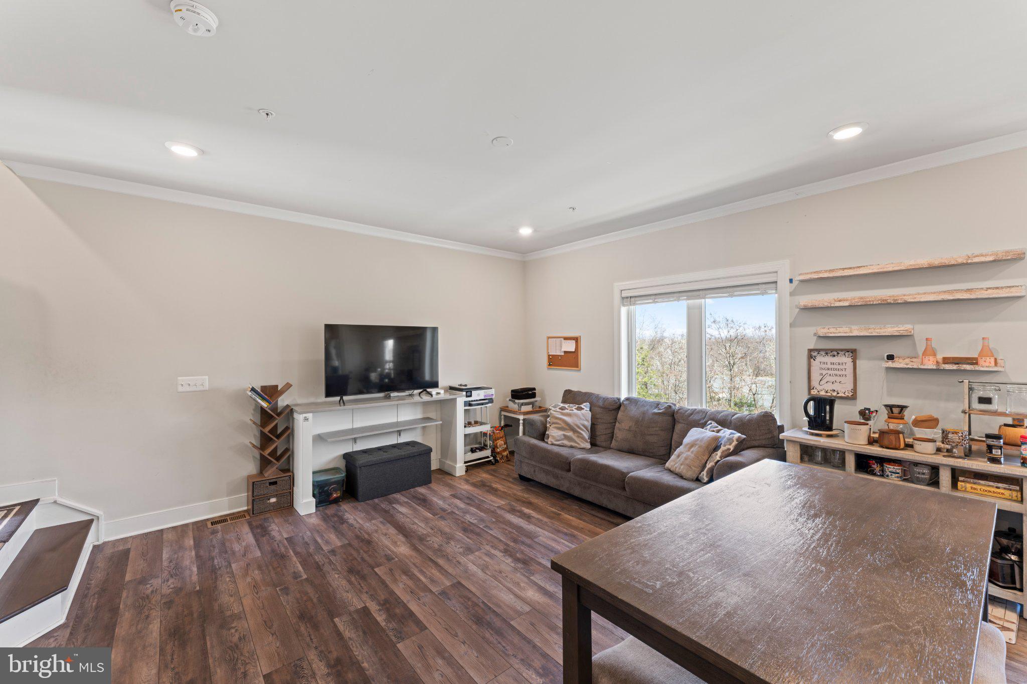 1330 Rail Woodbridge, VA 22191 - Photo 6 of 28 a living room with furniture a flat screen tv a rug and a fireplace