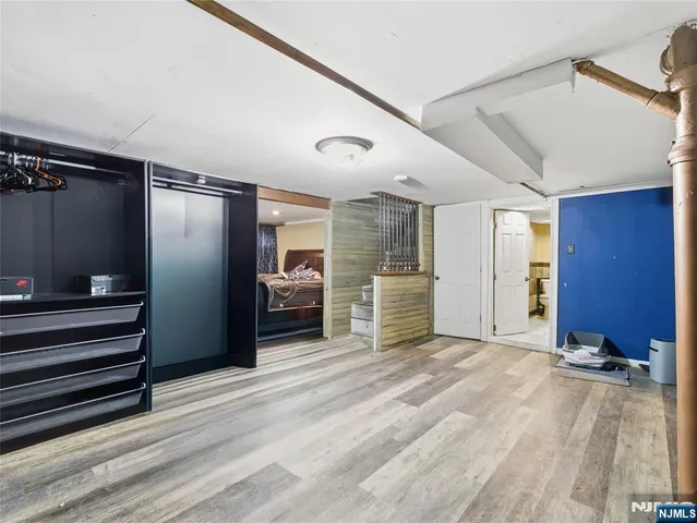 a view of a kitchen with a sink and refrigerator