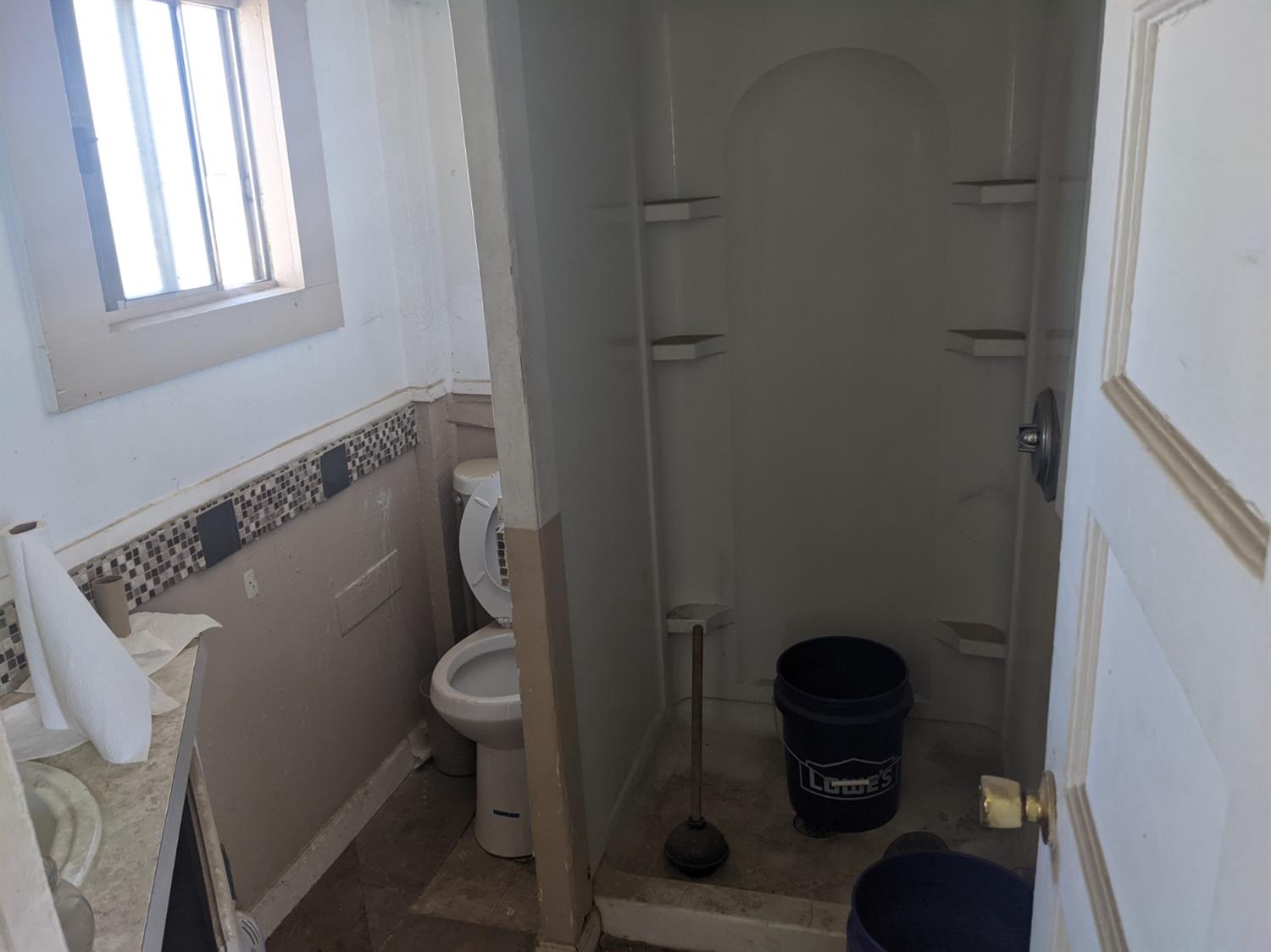 26492 Harrison Road Visalia, CA 93277 - Photo 16 of 29 a bathroom with a toilet and a sink