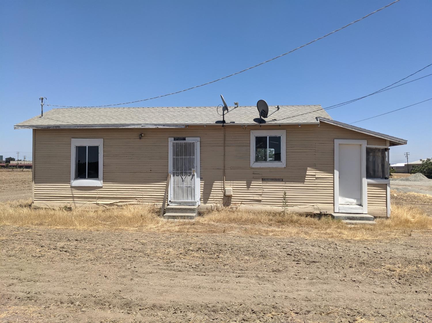 26492 Harrison Road Visalia, CA 93277 - Photo 3 of 29 a house view with a outdoor space