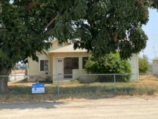 26492 Harrison Road Visalia, CA 93277 - Photo 21 of 29 a front view of a house with a garden