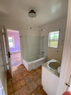 26492 Harrison Road Visalia, CA 93277 - Photo 24 of 29 a bathroom with a tub sink and mirror