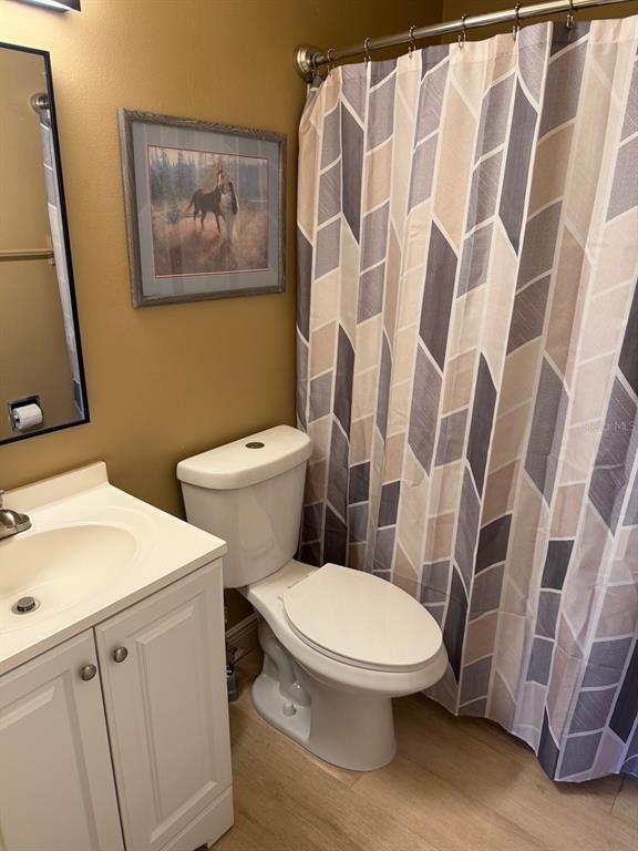 11248 Pendleton Avenue, Unit A&B Englewood, FL 34224 - Photo 12 of 15 a white toilet sitting next to a bathroom sink