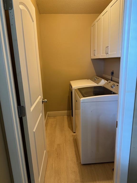 11248 Pendleton Avenue, Unit A&B Englewood, FL 34224 - Photo 13 of 15 a utility room with wooden floor washer and dryer