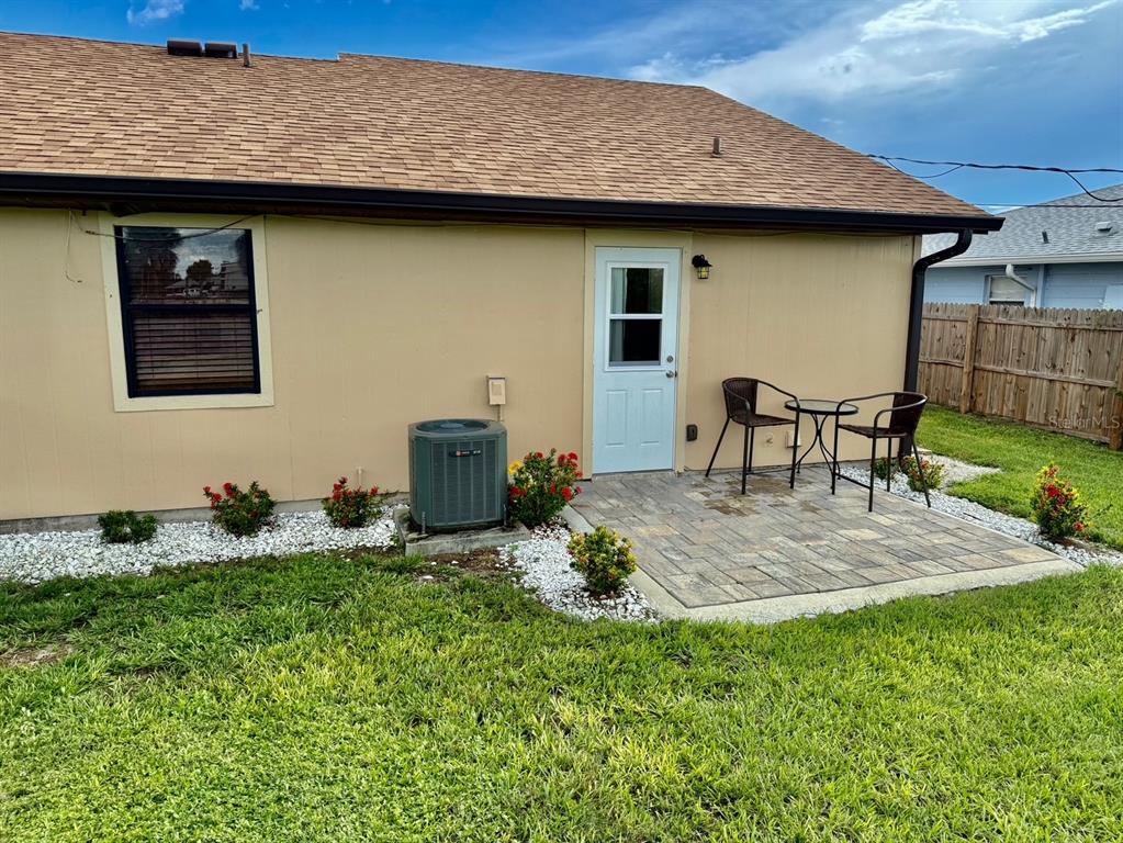11248 Pendleton Avenue, Unit A&B Englewood, FL 34224 - Photo 15 of 15 a backyard of a house with table and chairs