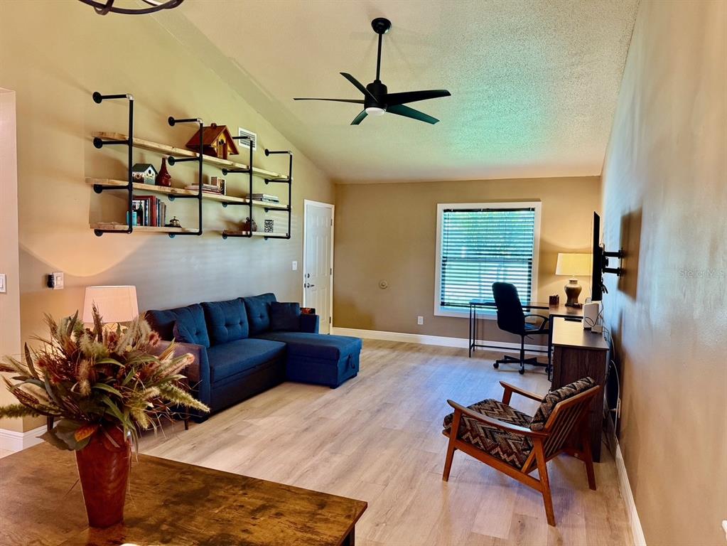 11248 Pendleton Avenue, Unit A&B Englewood, FL 34224 - Photo 3 of 15 a living room with furniture rug and window