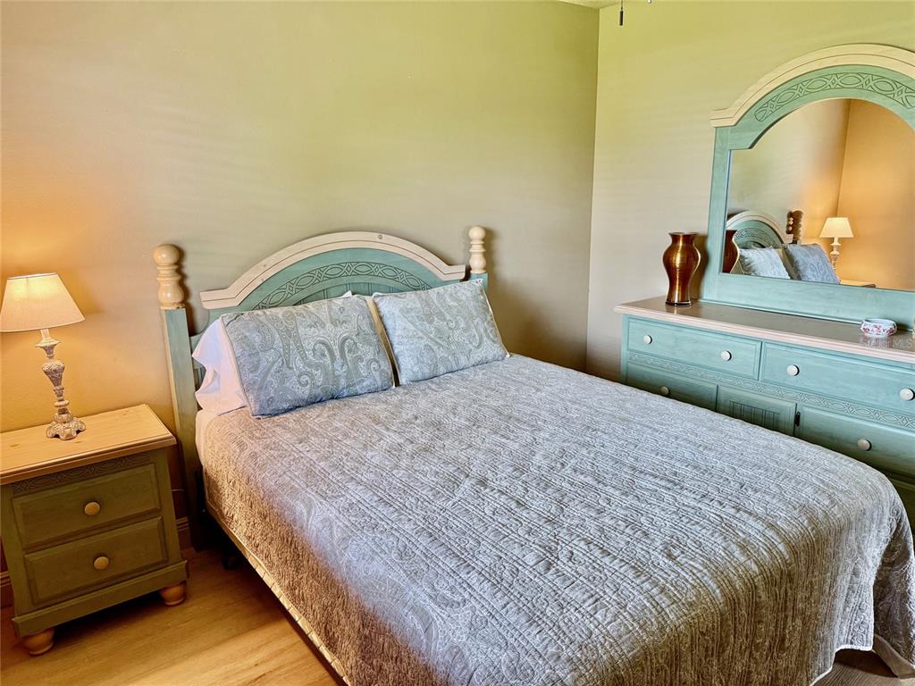 11248 Pendleton Avenue, Unit A&B Englewood, FL 34224 - Photo 6 of 15 a bedroom with a bed and dresser