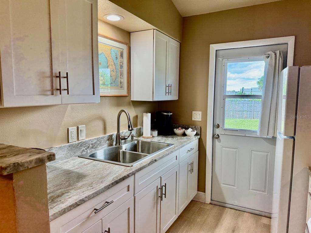 11248 Pendleton Avenue, Unit A&B Englewood, FL 34224 - Photo 9 of 15 a kitchen with sink and cabinets