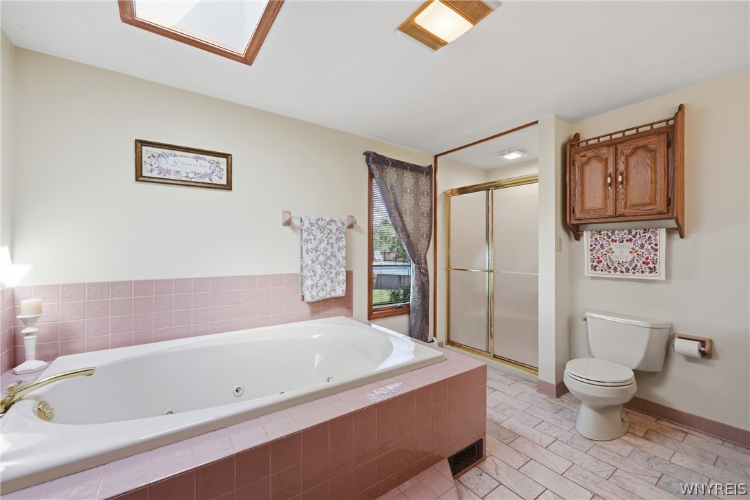 12 Beverly Drive Evans, NY 14006 - Photo 17 of 41 Jacuzzi tub in primary bedroom bathroom
