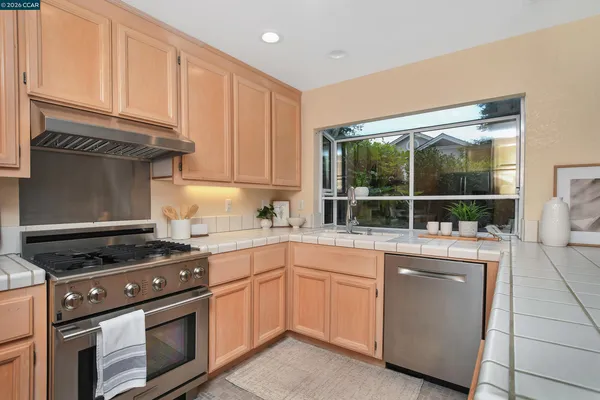 a kitchen with a stove and a sink