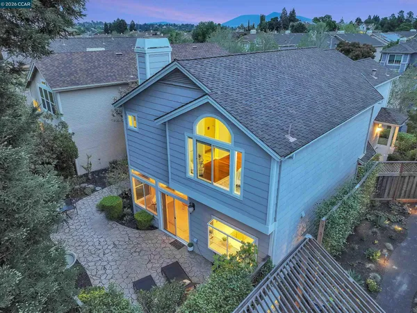 a aerial view of a house with a yard