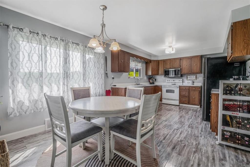 360 Jo Ann Drive Monessen, PA 15062 - Photo 11 of 48 a view of a dining room with furniture window and wooden floor