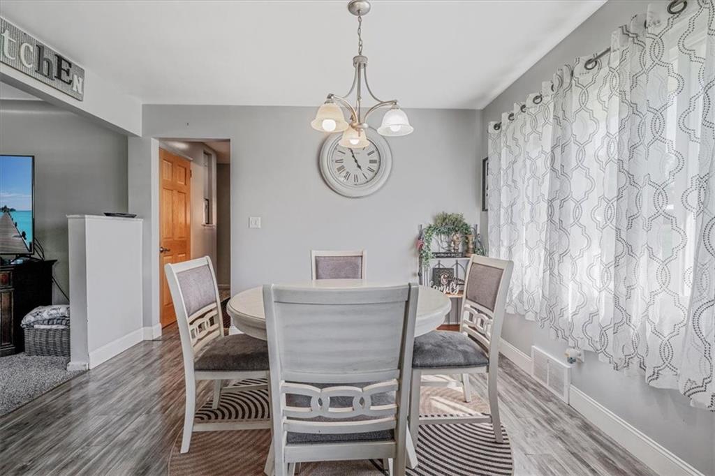 360 Jo Ann Drive Monessen, PA 15062 - Photo 12 of 48 a view of a dining room with furniture wooden floor and a chandelier