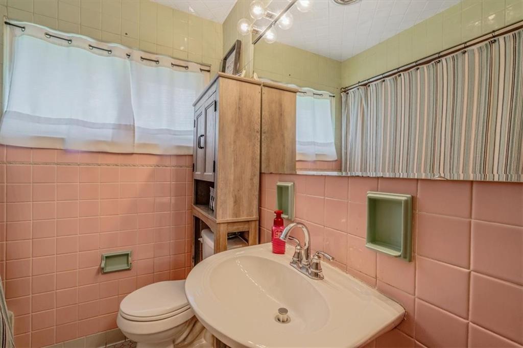 360 Jo Ann Drive Monessen, PA 15062 - Photo 19 of 48 a bathroom with a sink a toilet and shower