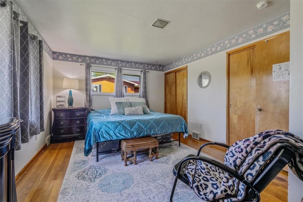 360 Jo Ann Drive Monessen, PA 15062 - Photo 27 of 48 a bedroom with a bed and wooden floor