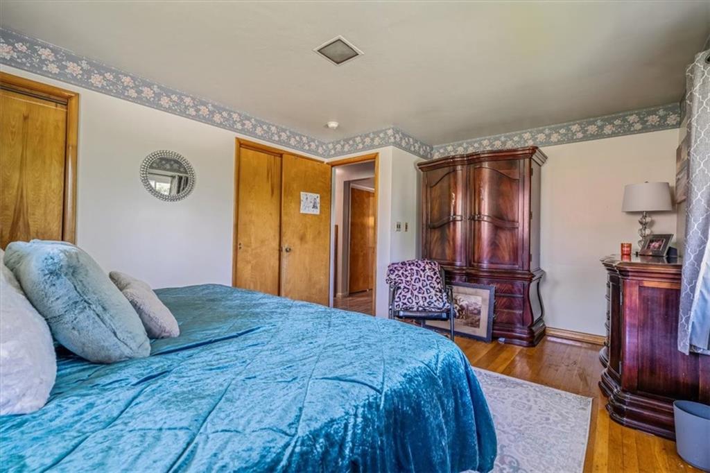 360 Jo Ann Drive Monessen, PA 15062 - Photo 28 of 48 a bedroom with a bed and wooden floor