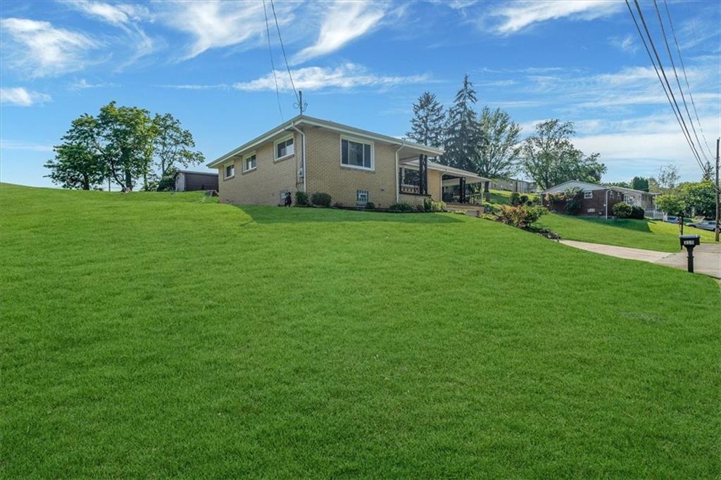 360 Jo Ann Drive Monessen, PA 15062 - Photo 3 of 48 a front view of a house with garden