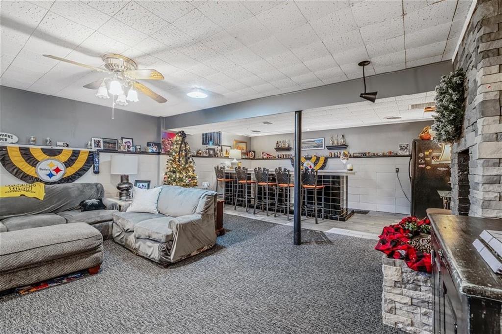 360 Jo Ann Drive Monessen, PA 15062 - Photo 35 of 48 a living room with furniture and a chandelier