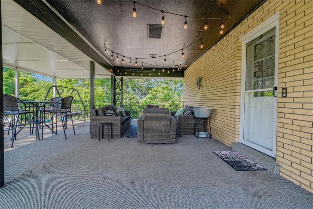 360 Jo Ann Drive Monessen, PA 15062 - Photo 41 of 48 a building outdoor space with patio furniture and potted plants